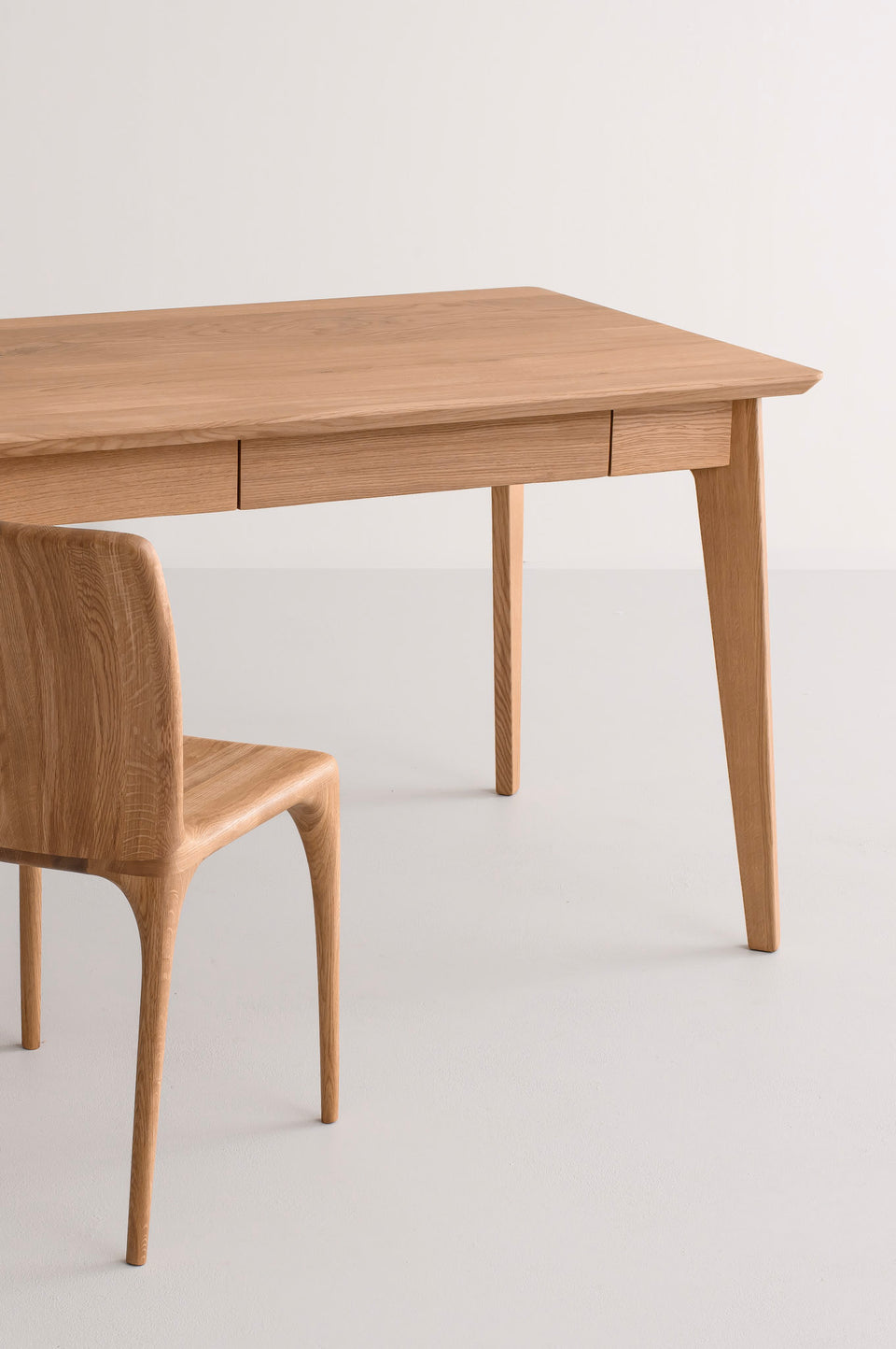 Integrated drawers sit within the apron for a clean, uninterrupted profile.