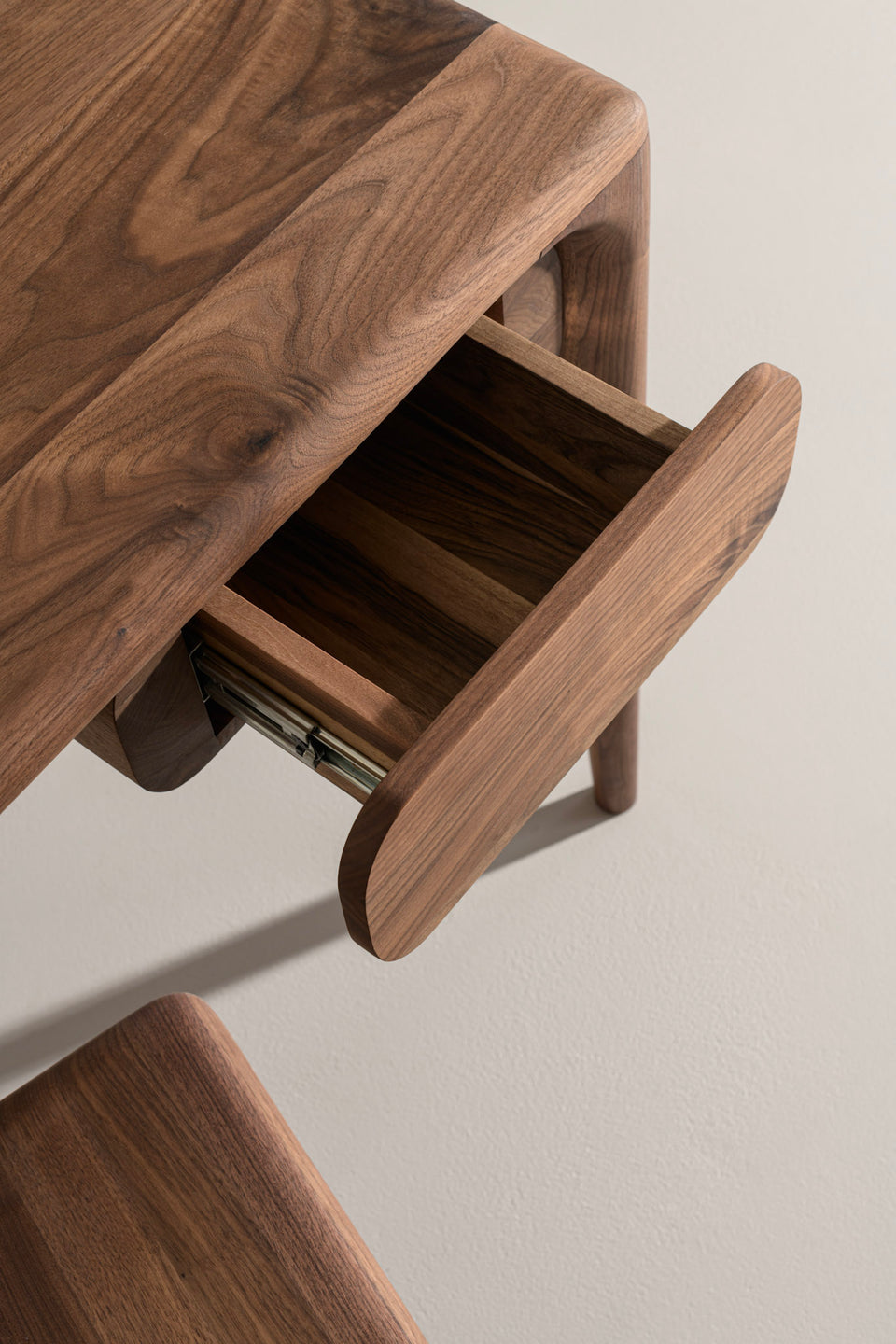The smallest size has one drawer with a mounting system that lets you reposition it from left to right