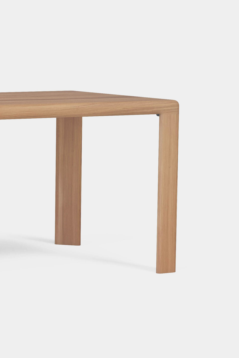 Triangular legs integrated directly into the tabletop.
